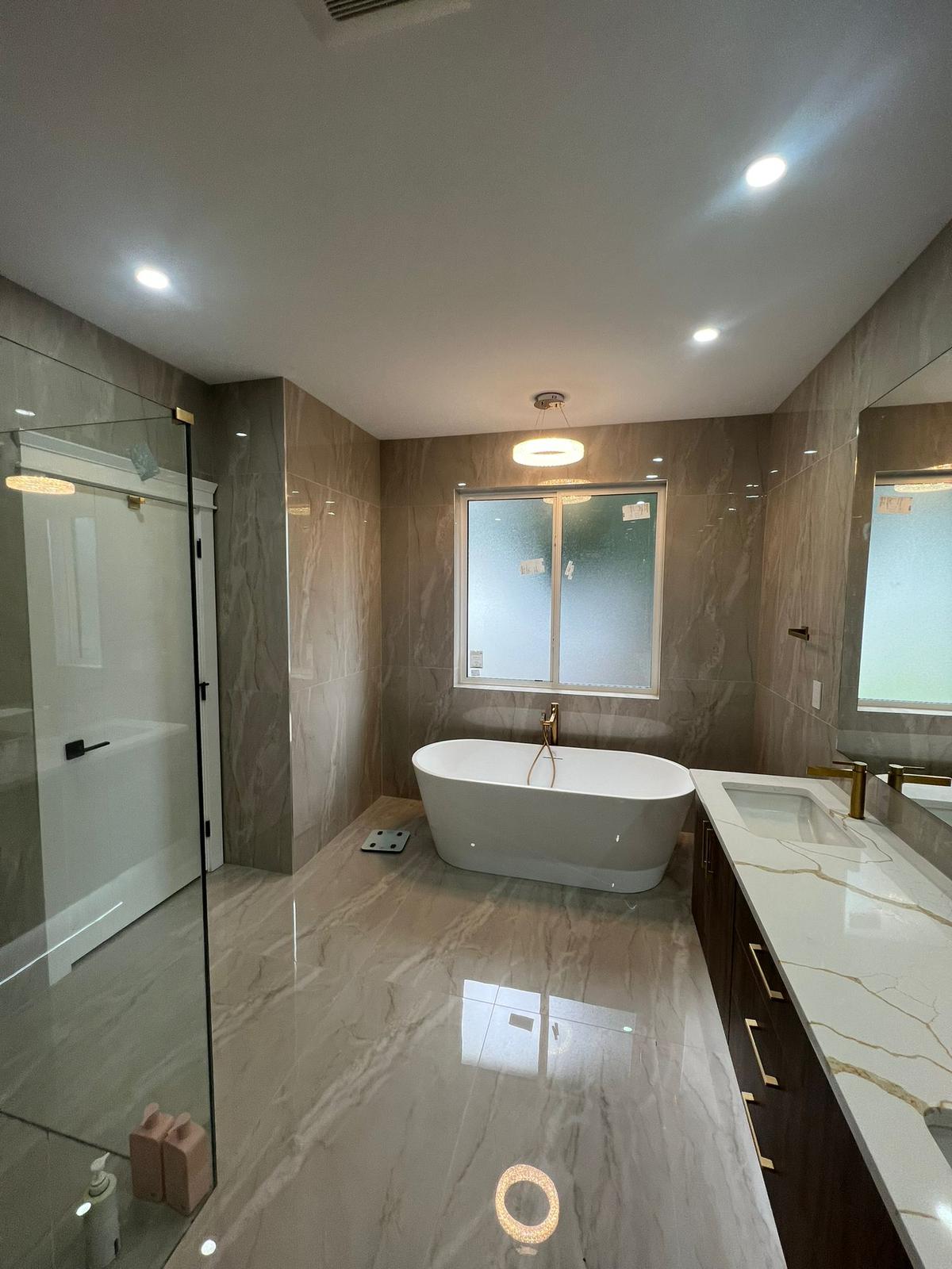Master Washroom with standing custom shower and free standing bathtub